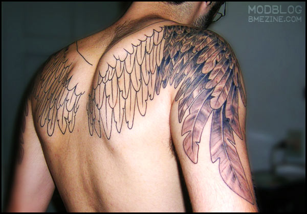 See also this long wings tattoo and another big set of tattooed wings
