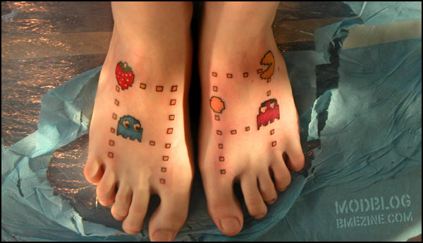 It's no Pacman assmaze but I still like this nerdy Pacman foot tattoo by