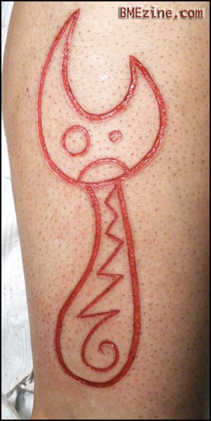 Can Opener scarification by Brian Decker