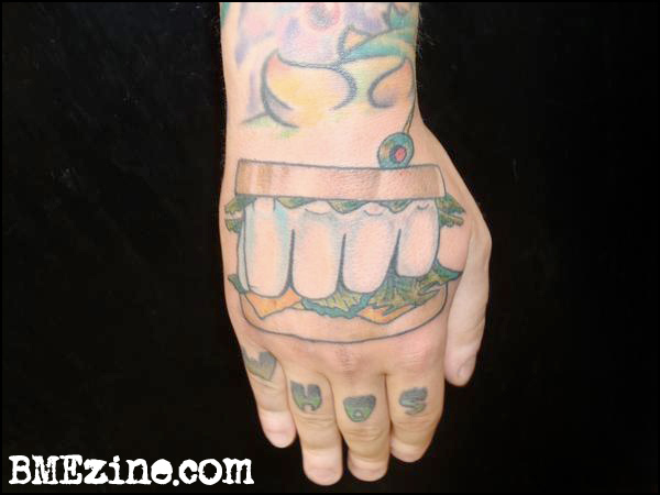Knuckle sandwich hand tattoo