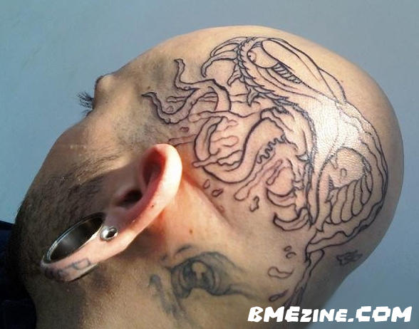 You know what else is cool That ear lobe tattoo I am sure this guy wasn't
